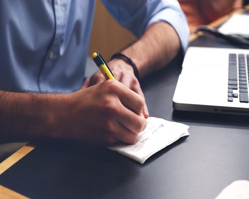 man working at desk and drinking water in a calm environment