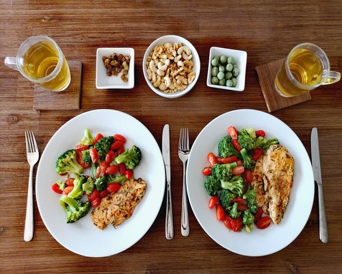 home dinner setup with plates and healthy food